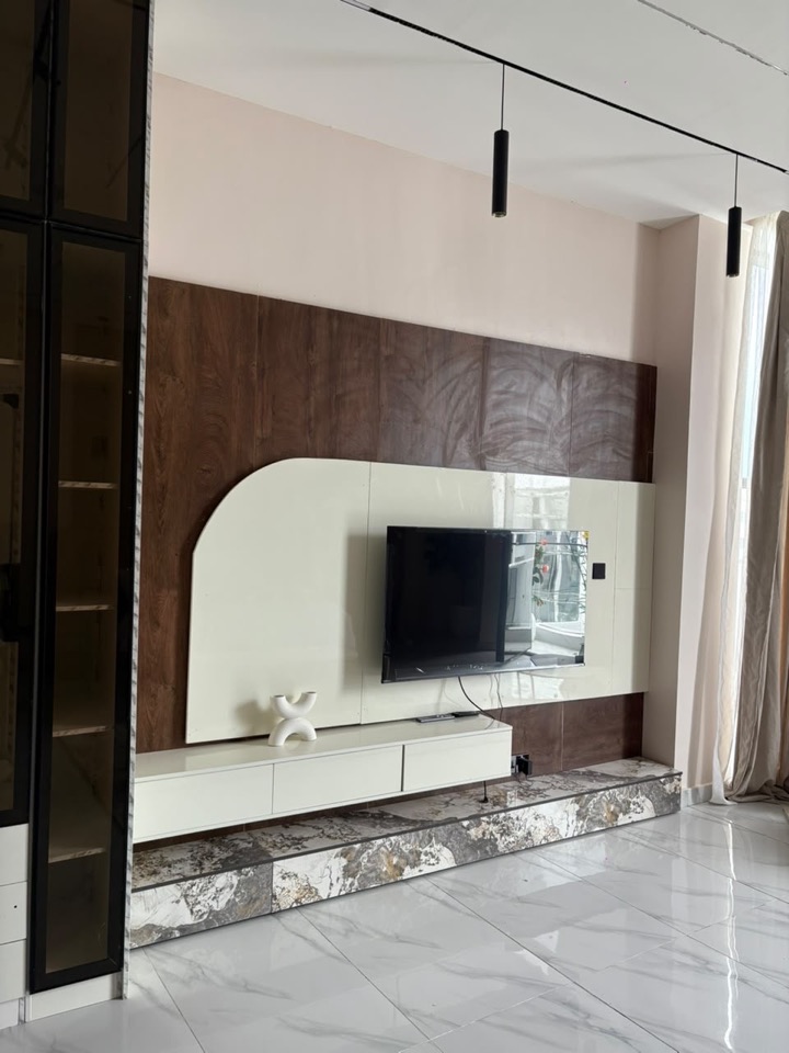 White media wall with curved shelving and timber inset